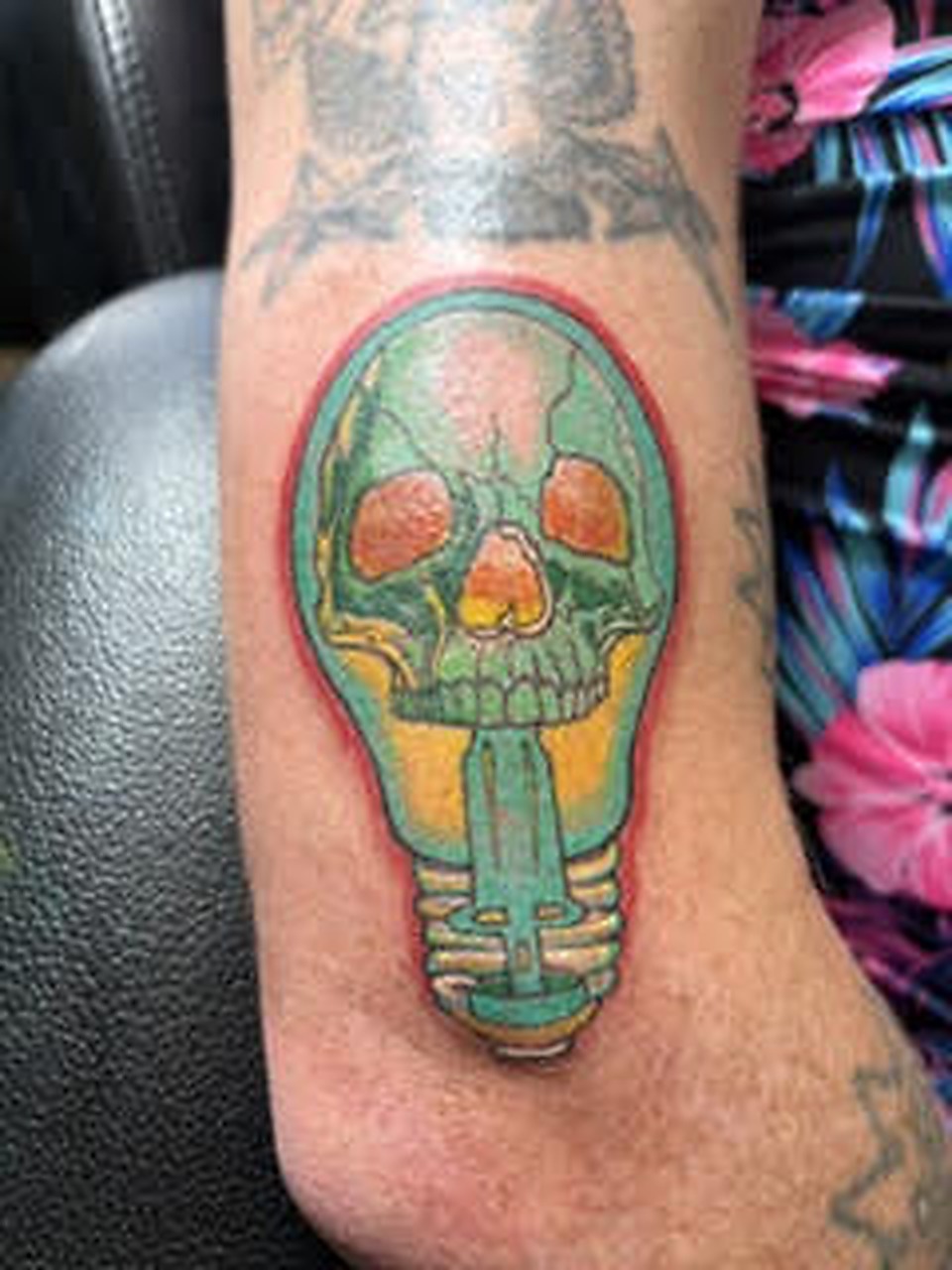 Color skull tattoo by Danny Kope at Rockstar Tattoo